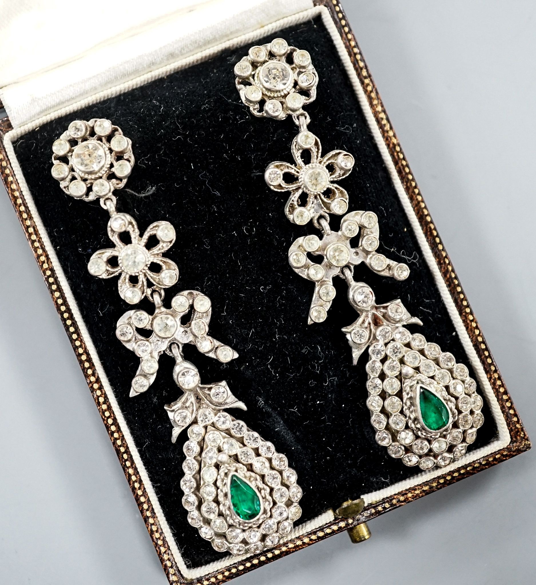 A pair of white metal and two colour paste drop earrings, 68mm, in a gilt tooled leather box.